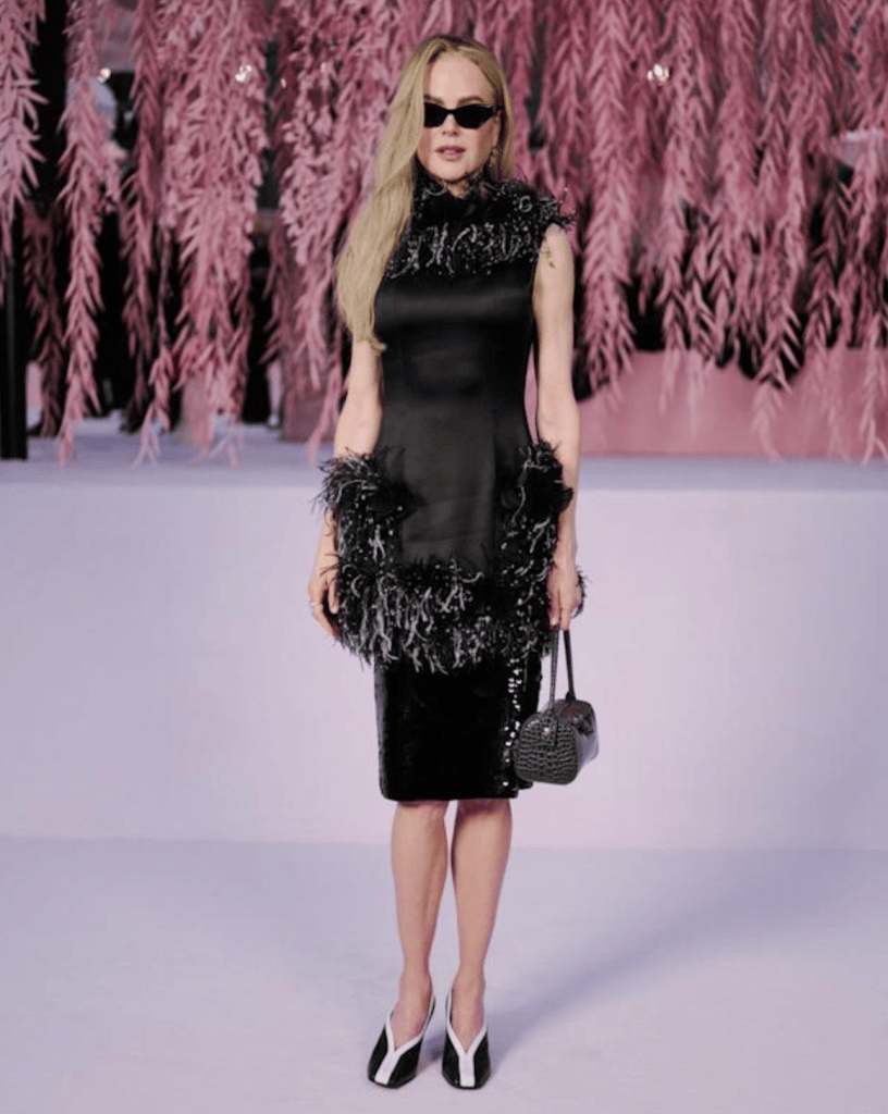 Nicole Kidman in a black dress with feather trim